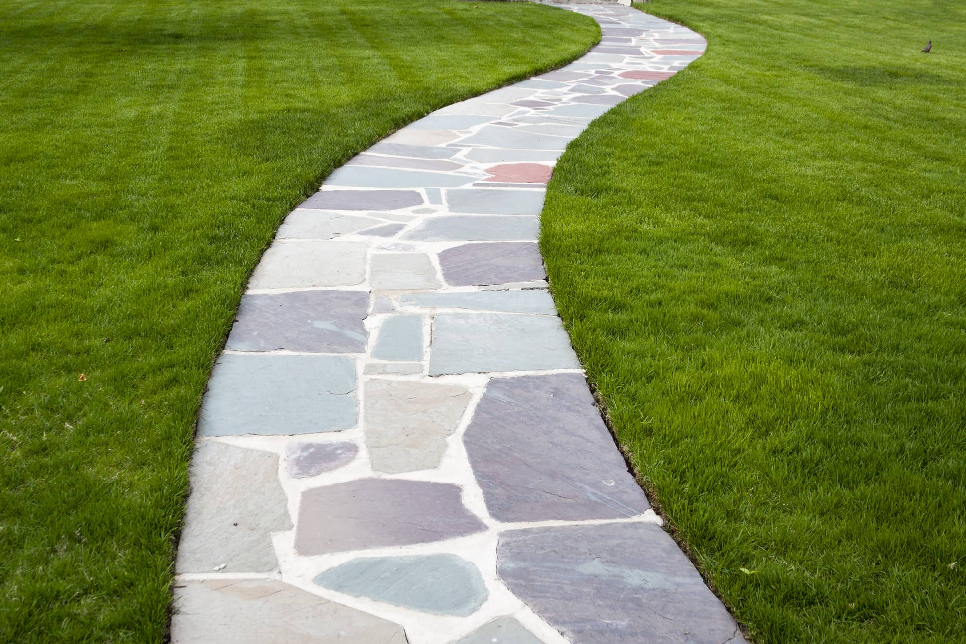 This is an image of a stone walkway with concrete.